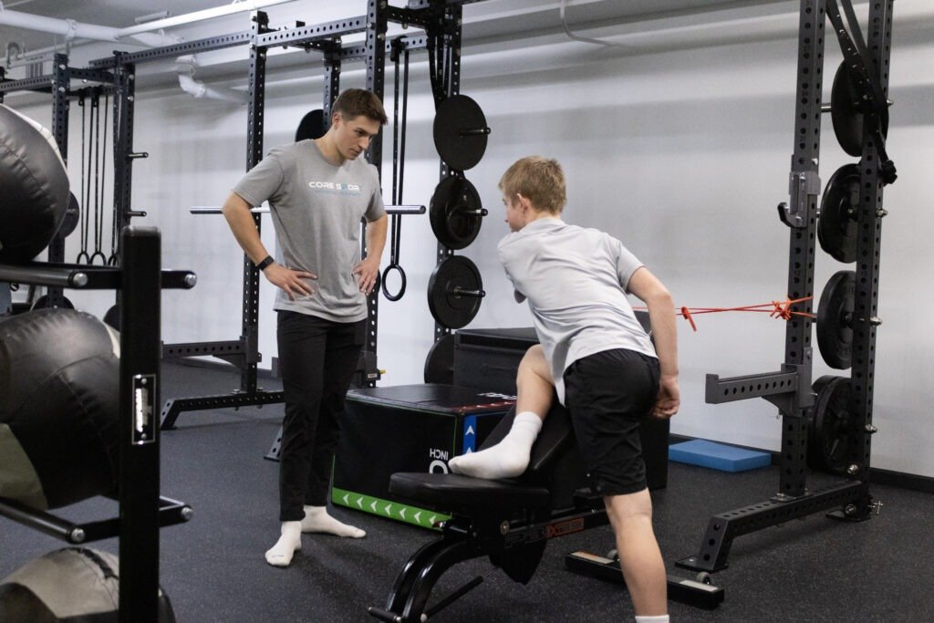Athlete recovering from knee injury during sports rehabilitation session at Core Sport in Evergreen Park IL